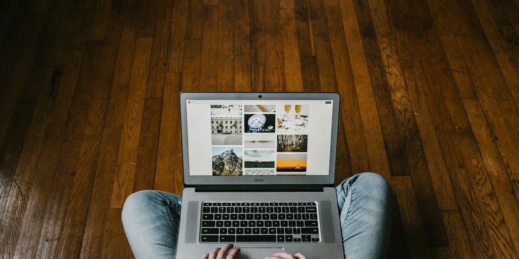 person using laptop on lap